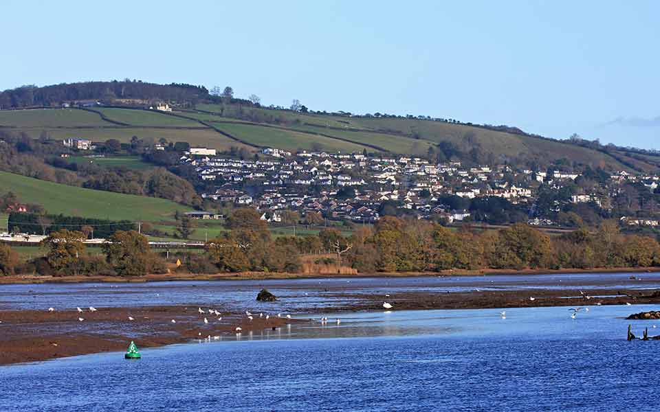River at low tide houses in the background