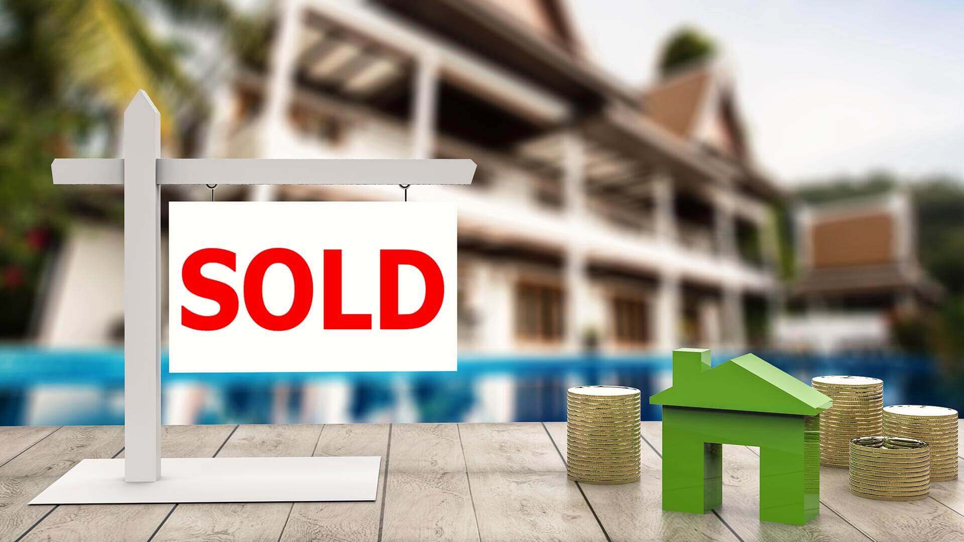 Sold sign in front of a house