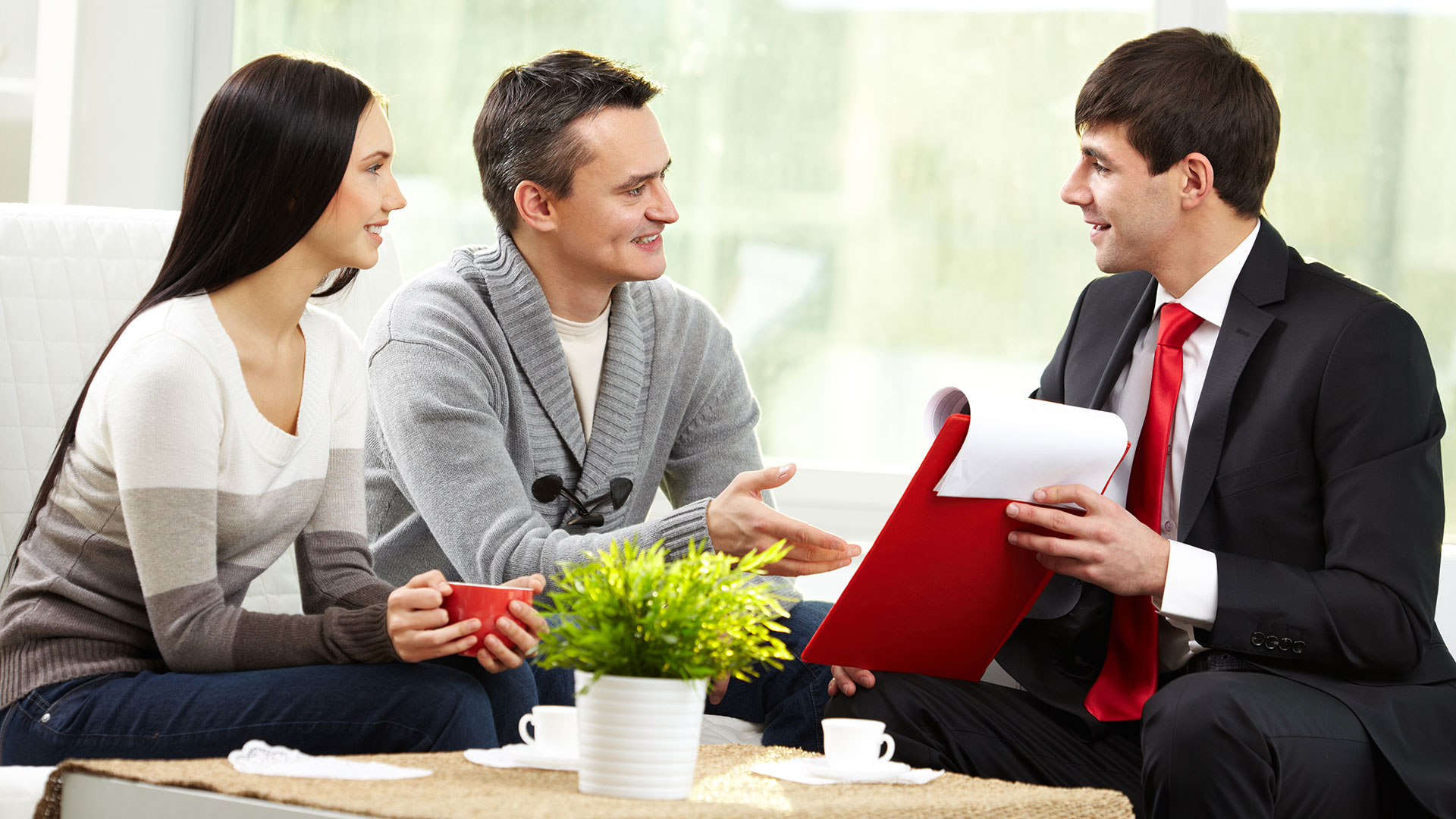 Couple talking to an agent
