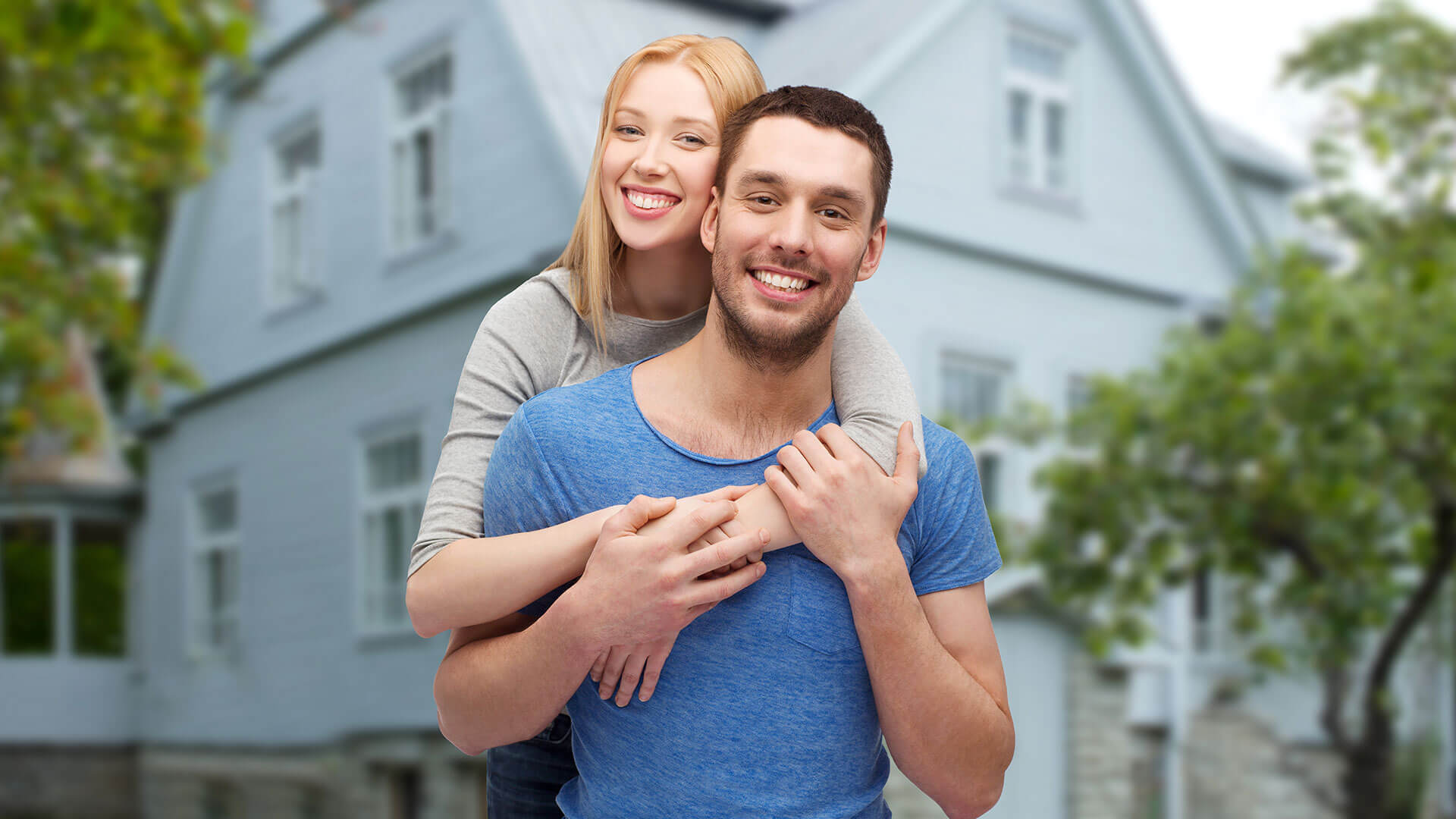Couple outside their home
