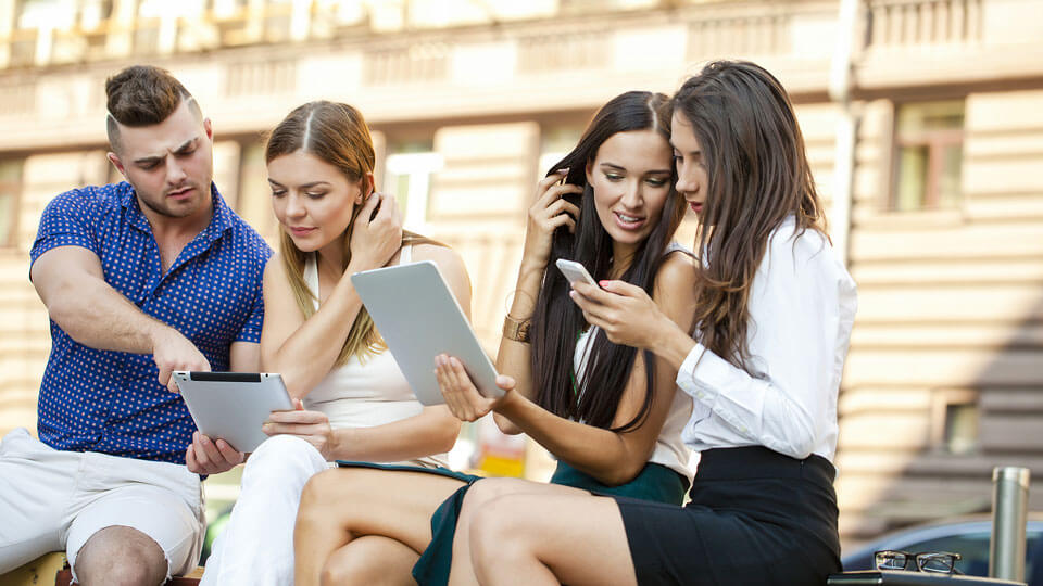 Group of people working on tablets
