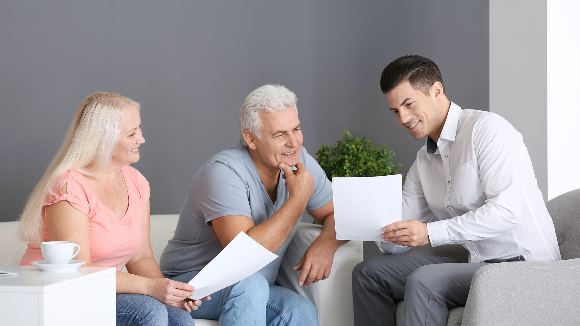 Couple talking to an agent